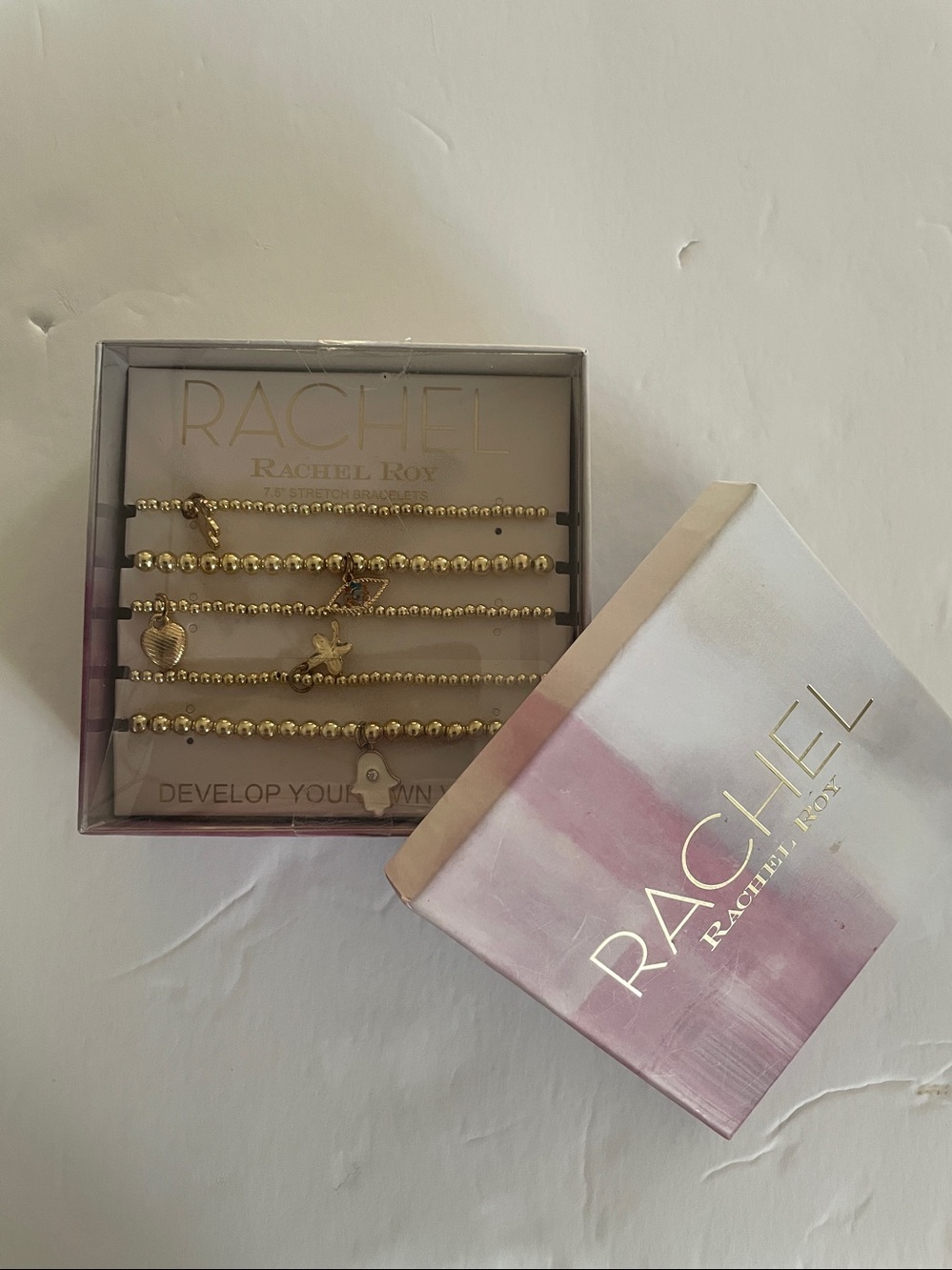Rachel Roy Gold Tone Stretch Charm Bracelets 5 pack New! 
7.5” stretch